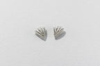 Pair of silver earrings on a light gray background